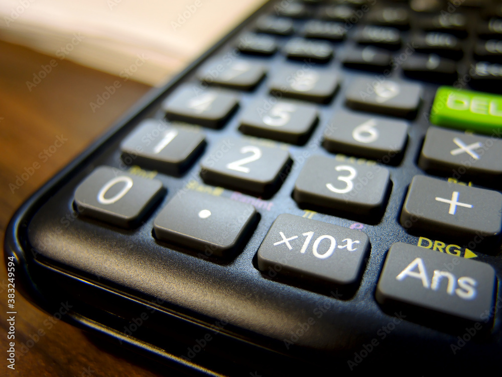 Detail of generic black scientific calculator Detail of generic black scientific calculator