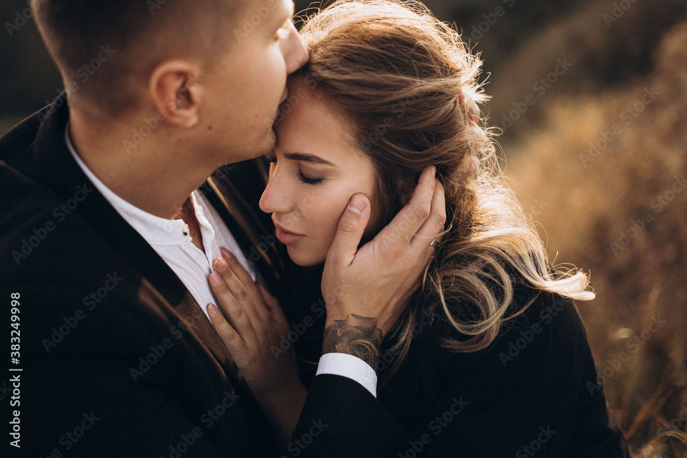 couple kissing in park autumn couple kissing in park autumn