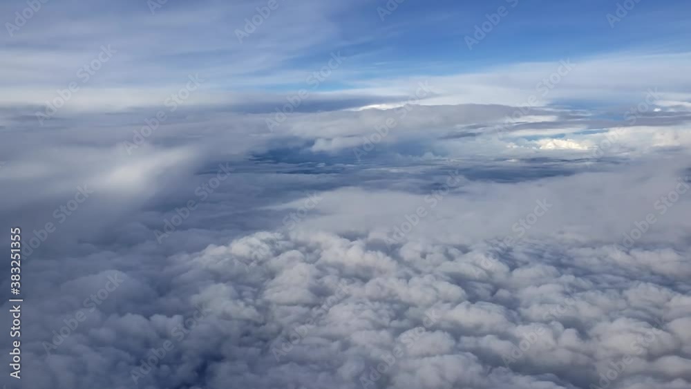 View from the airplane window. Fluffy clouds. Flight by plane. View from the airplane window. Fluffy clouds. Flight by plane.