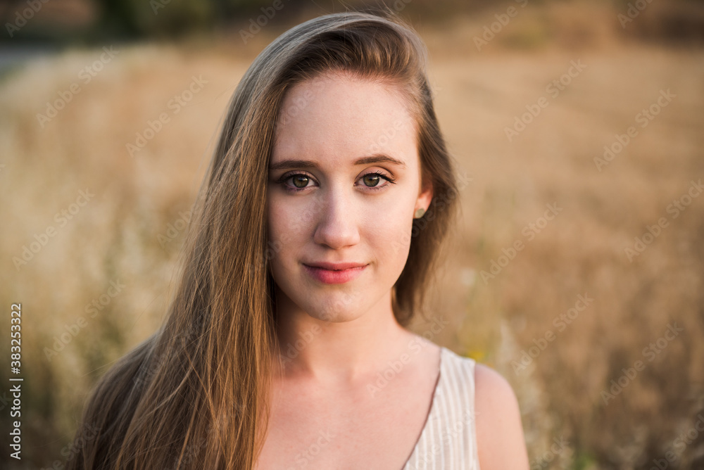 Portrait of a beautiful blonde close up. Gorgeous girl looking at camera background selective focus Portrait of a beautiful blonde close up. Gorgeous girl looking at camera background selective focus