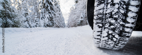 wintertyres on snow covered road © Wolfilser