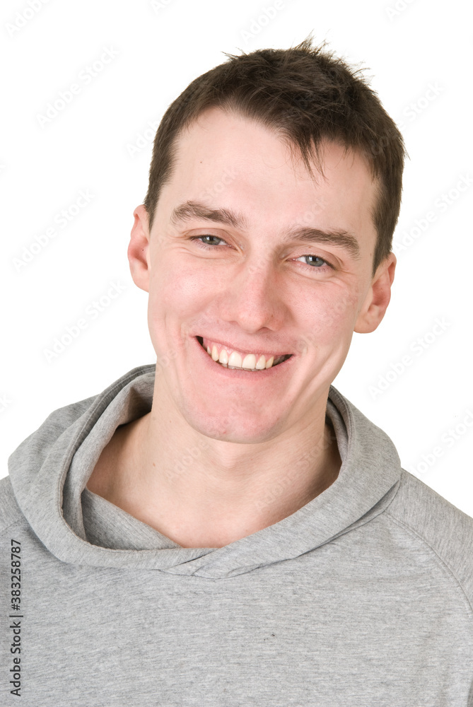 Young man in a gray sweatshirt on a white background