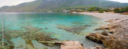 Panoramic view of the Greek village Porto Germeno and  beautiful beach Agios Nikolaos in the Corinthian Gulf of the Ionian sea in Greece on a cloudy autumn day photo