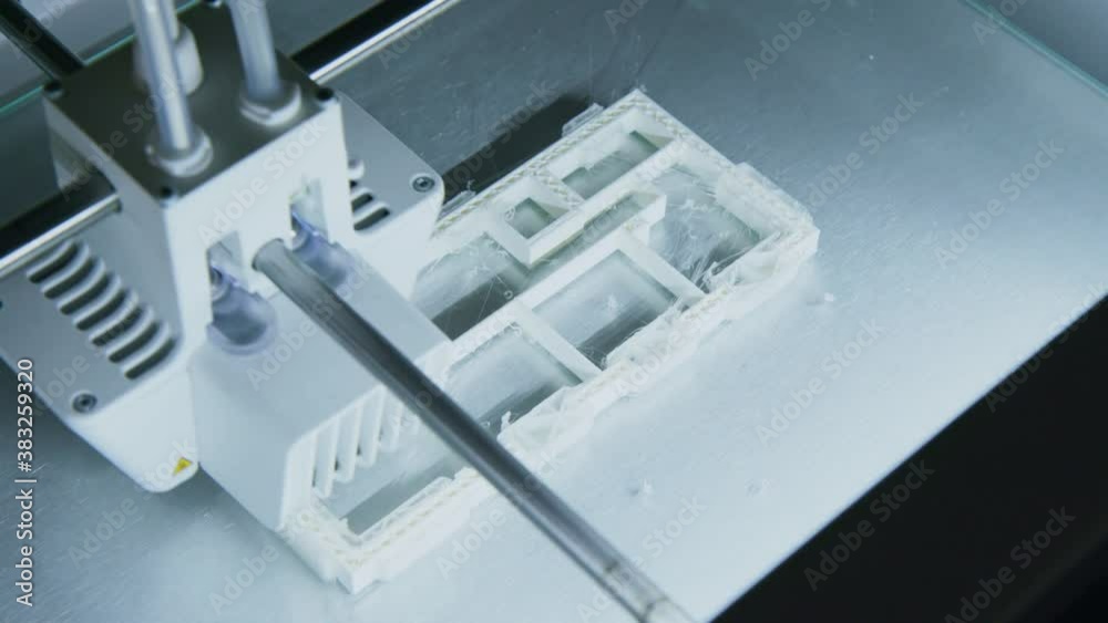3D printer working on printing an architects building plan in office, Modern Day Technology 3D printer working on printing an architects building plan in office, Modern Day Technology