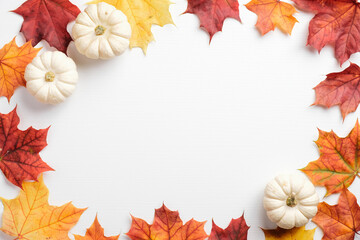 Autumn leaves and pumpkins border frame on white table. Seasonal background. Autumn fall, thanksgiving, harvest concept. Flat lay, top view.