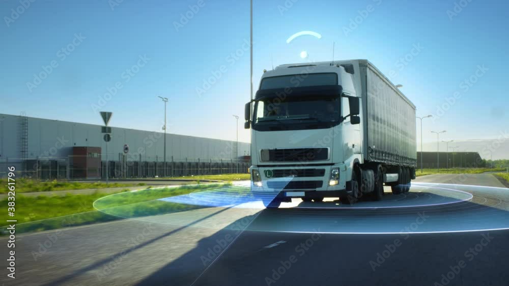 Futuristic High-Tech Concept: Big Autonomous Semi-Truck with Cargo Trailer Drives on the Road with Concept Sensors Scanning.Graphics, Special Effects of Futuristic Self Driving Truck Analyzing Freeway