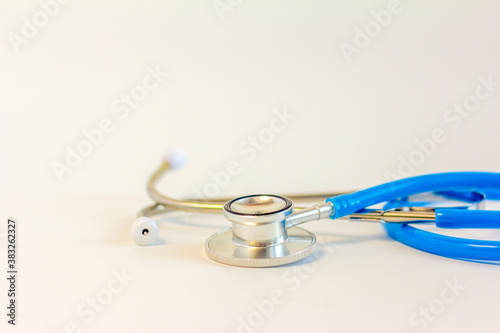 Blue medical stethoscope on a white background,close-up.