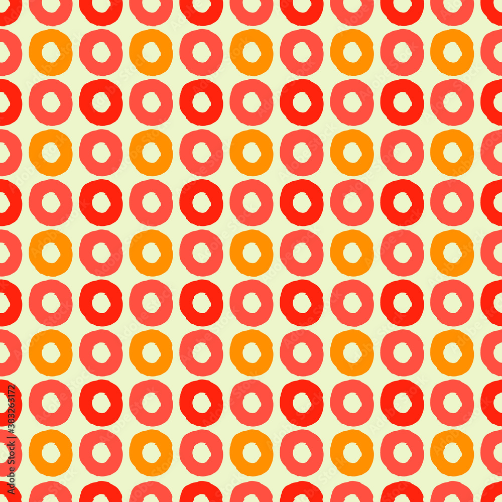 Seamless geometric pattern with hand drawn uneven rings in pink and orange for gift wrap, surface design and other design projects