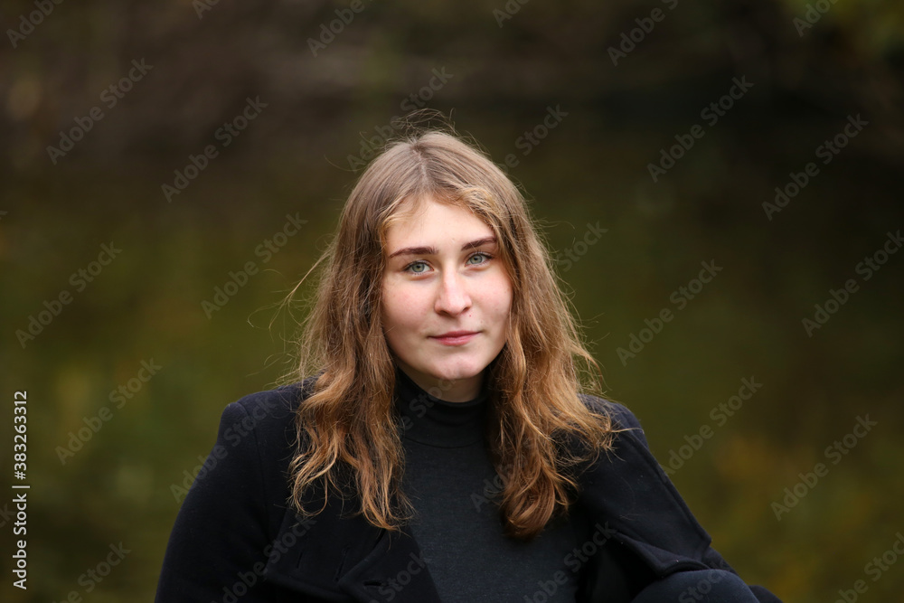 Portrait of young woman outside