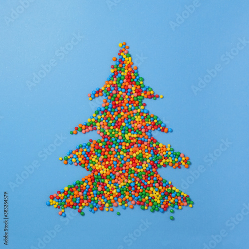 Christmas tree made of colored sugar balls. New year and christmas postcard. photo