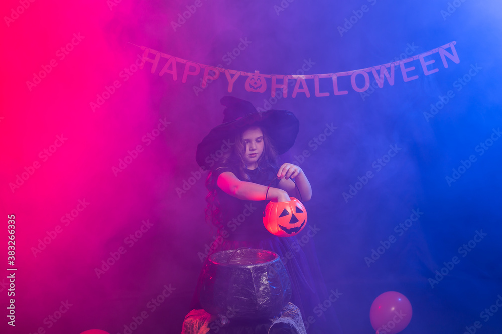 Funny child girl in witch costume for Halloween with pumpkin Jack. Funny child girl in witch costume for Halloween with pumpkin Jack.