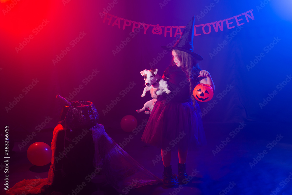 Funny child girl in witch costume for Halloween with pumpkin Jack and dog. Funny child girl in witch costume for Halloween with pumpkin Jack and dog.