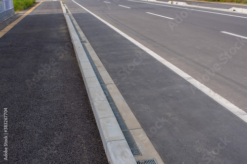 roadways and sidewalks reflected the shadow of the building