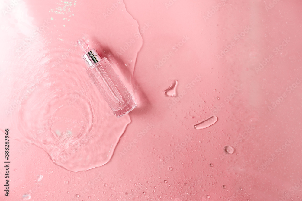 Glass Bottle with fluid collagen and hyaluronic acid, hydration skin. Top flatlay view copyspace. Abstract water background.