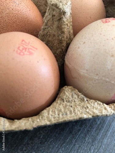 Brown eggs in a cardboard box