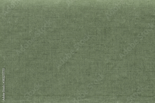 Vintage and old looking paper background. Colored green retro book cover. Ancient book page.