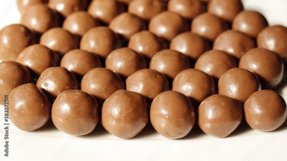 A group of chocolate balls on a white background A group of chocolate balls on a white background