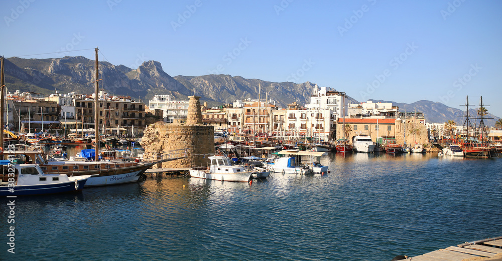 Kyrenia (Girne), CYPRUS - MARCH, 2020: Blue hour view in Kyrenia harbour . Kyrenia harbor is currently a famous tourist resort.