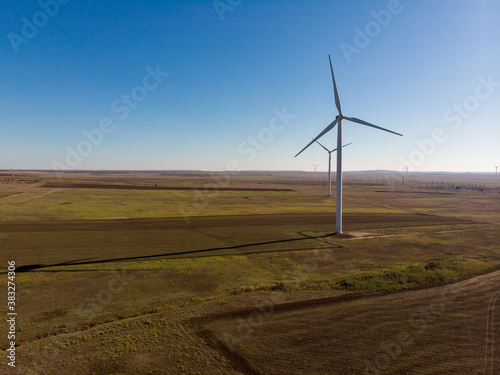 windmills work in a summer field