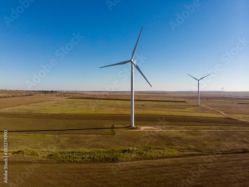 windmills work in a summer field