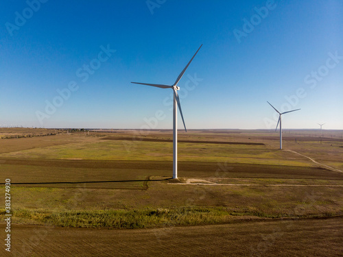 windmills work in a summer field