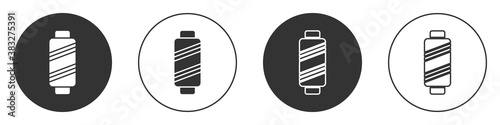 Black Sewing thread on spool icon isolated on white background. Yarn spool. Thread bobbin. Circle button. Vector Illustration.