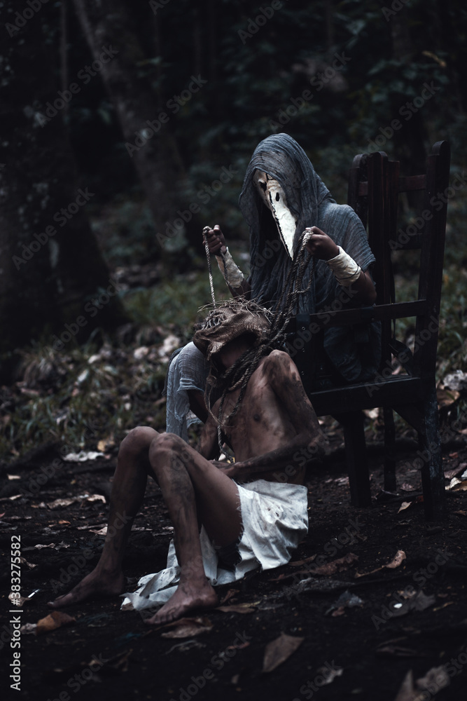 grim reaper and scary scarecrow as a slave in the dark forest. Halloween  background Stock Photo | Adobe Stock