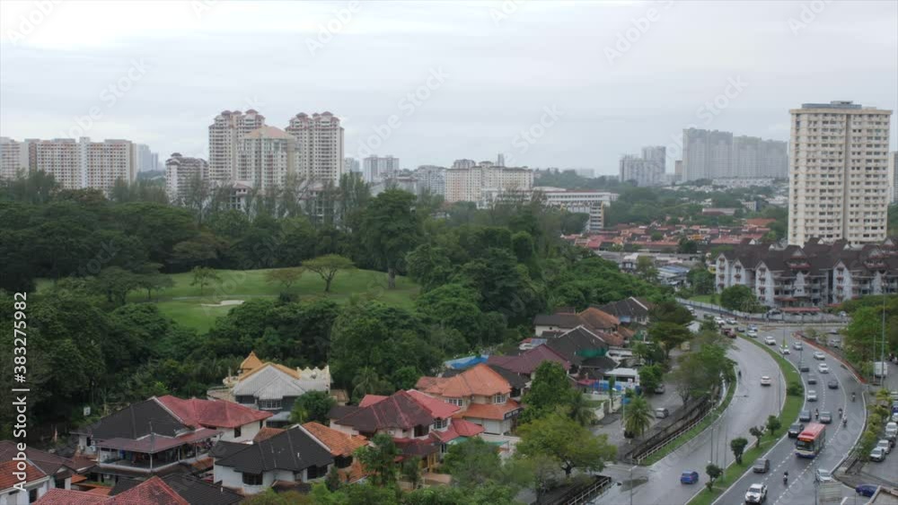 raining day with forest, high rise buildings at the background with wide angle view raining day with forest, high rise buildings at the background with wide angle view