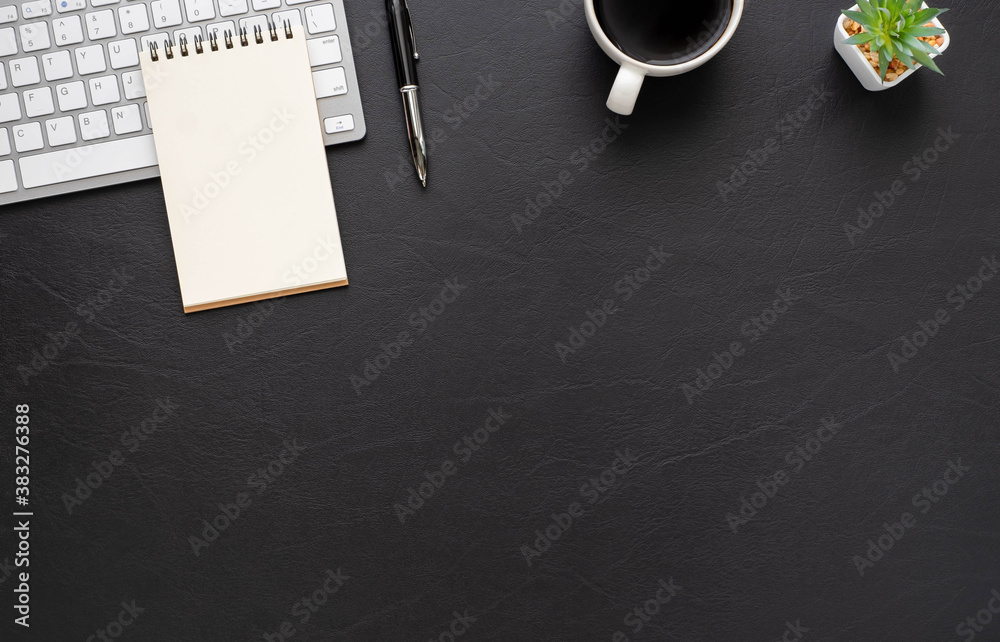 Black office desk table with keyboard, notebook and coffee cup with equipment office supplies. Business and finance concept. Workplace, Top view flat lay with blank copy space. Black office desk table with keyboard, notebook and coffee cup with equipment office supplies. Business and finance concept. Workplace, Top view flat lay with blank copy space.