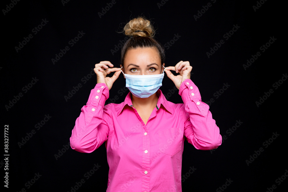 woman wearing mask on black background woman wearing mask on black background
