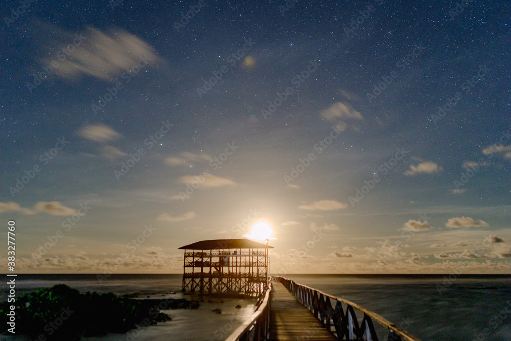 Moonrise at the Cloud 9 boardwalk and tower, Siargao island.