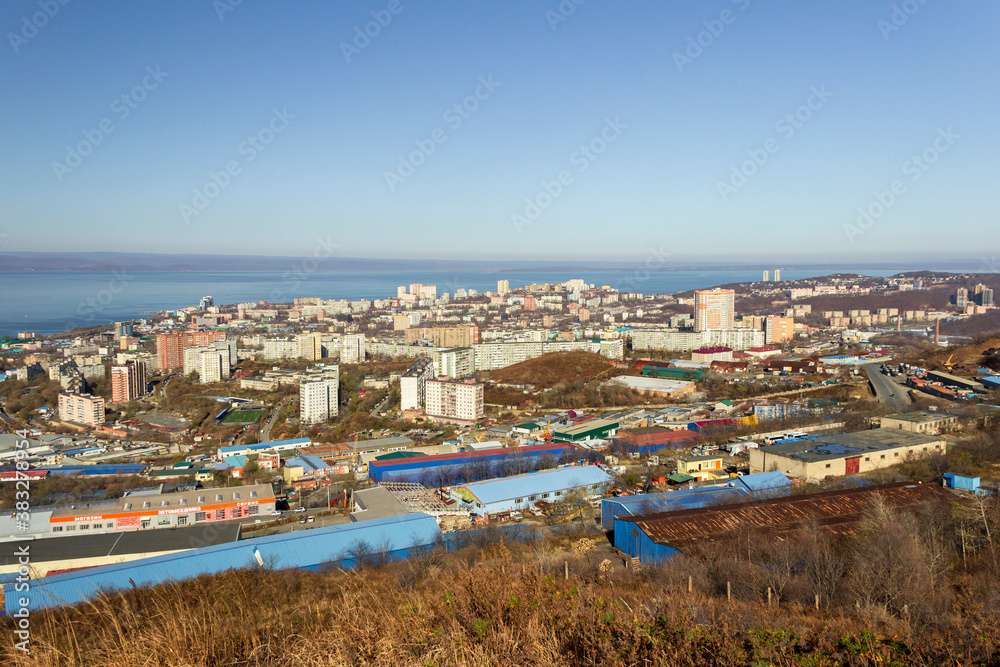 Vladivostok, Russia - October, 27, 2019: View of the industrial and residential areas of Vladivostok from the top of the Kholodilnik Hill.