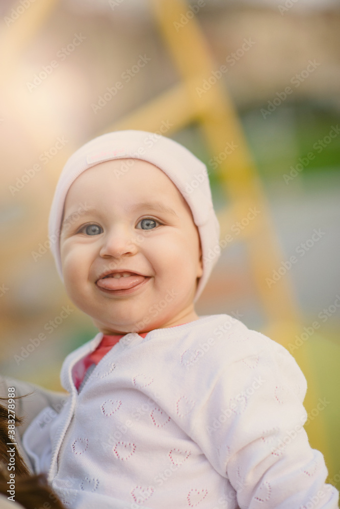 Little girl spending fantastic time on playground. Happy childhood. Authentic image. Little girl spending fantastic time on playground. Happy childhood. Authentic image.