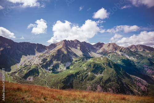 Fototapeta Naklejka Na Ścianę i Meble -  Banowka and Trzy Kopy - Western Tatra Mountains Range summits during sunny autumn day