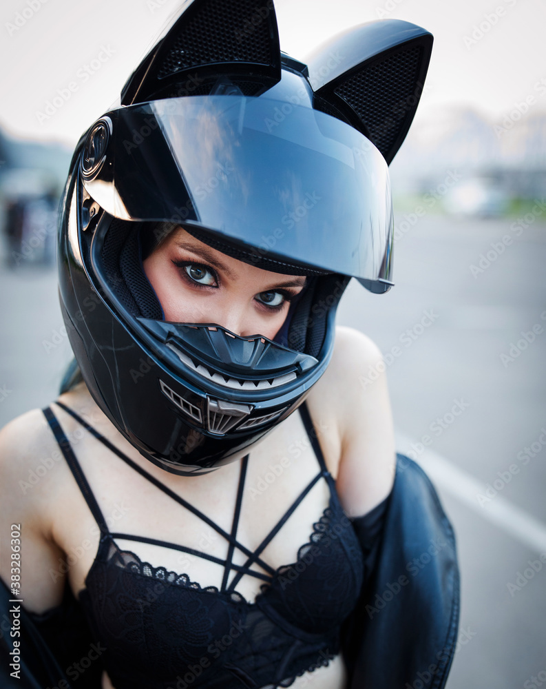 portrait of a girl in a motorcycle helmet.