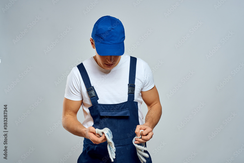 working man in uniform service lifestyle delivery service light background working man in uniform service lifestyle delivery service light background