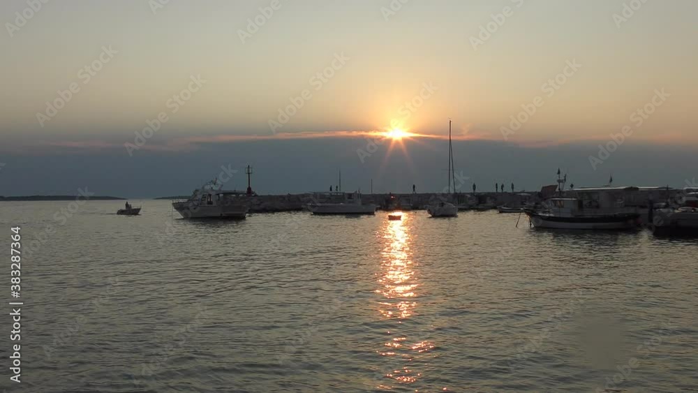 A colorful sunset over the Adriatic sea observed near the harbor of Fazana Croatia, Istria
A colorful sunset over the Adriatic sea observed near the harbor of Fazana Croatia, Istria