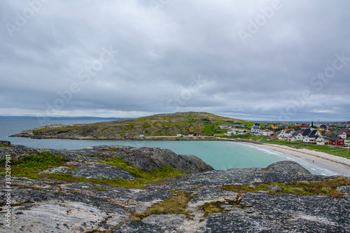 View from the rocks to the fishing village Bugoynes (Pykeija) and Barents Sea, Varangerfjord, Norway