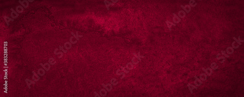 Intense burgundy color of hand-painted watercolor stains. Dark red abstract background with natural texture.