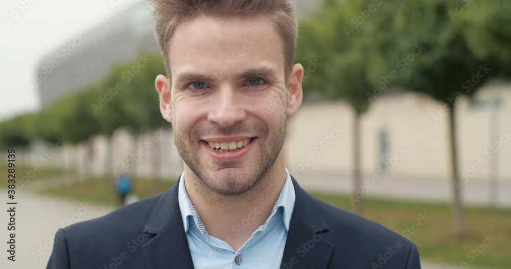 Portrait of Satisfied Male in Suit with charmingly Smile. European Businessman is looking at the Camera, getting Positive Emotions. Successful Lifestyle. Business People. Male Portraits. Portrait of Satisfied Male in Suit with charmingly Smile. European Businessman is looking at the Camera, getting Positive Emotions. Successful Lifestyle. Business People. Male Portraits.