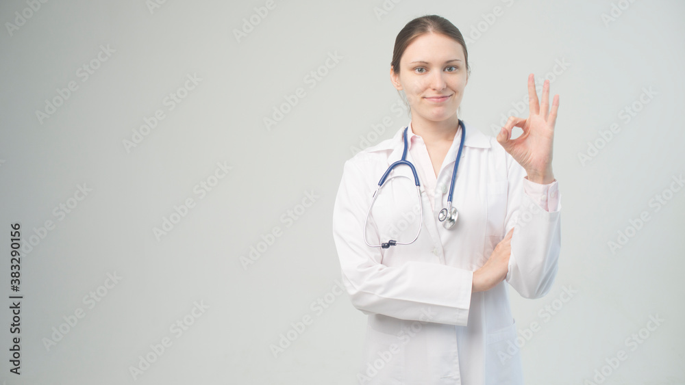 Portrait of an attractive young female doctor in white coat. Portrait of an attractive young female doctor in white coat.