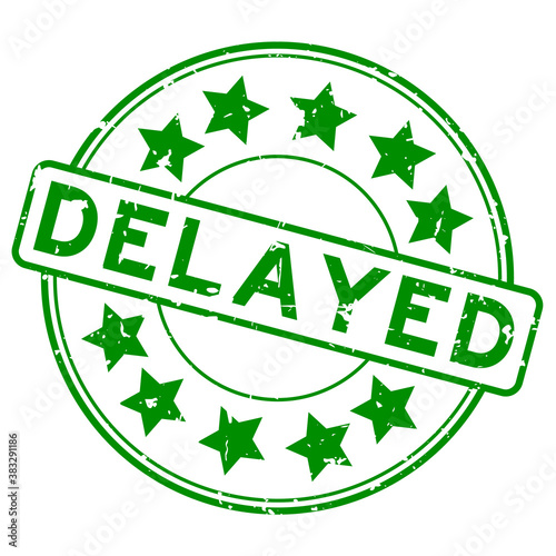 Grunge green delayed word with star icon round rubber seal stamp on white background