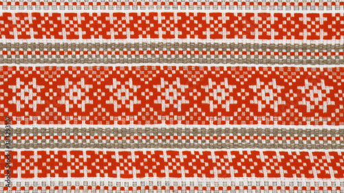Textile texture in red, brown and white colors. Belarus ornament