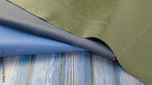 Natural leather textures samples on blue wooden background