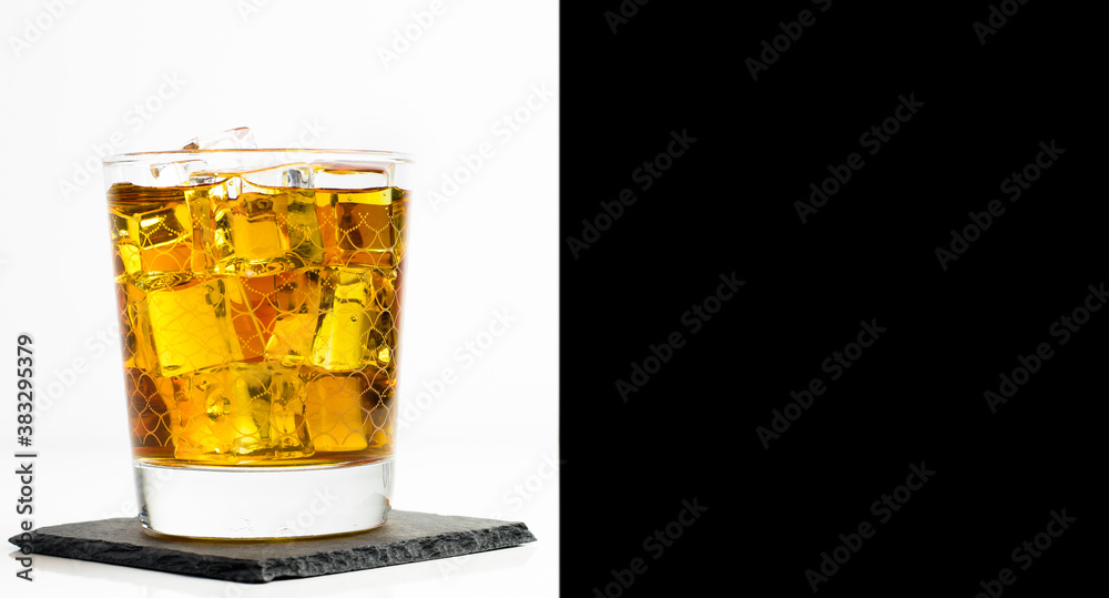 Scottish whisky in a glass served with ice Scottish whisky in a glass served with ice