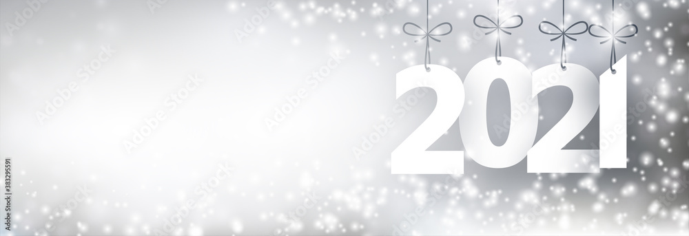 2021 paper sign hanging on ribbons on grey background. 2021 paper sign hanging on ribbons on grey background.