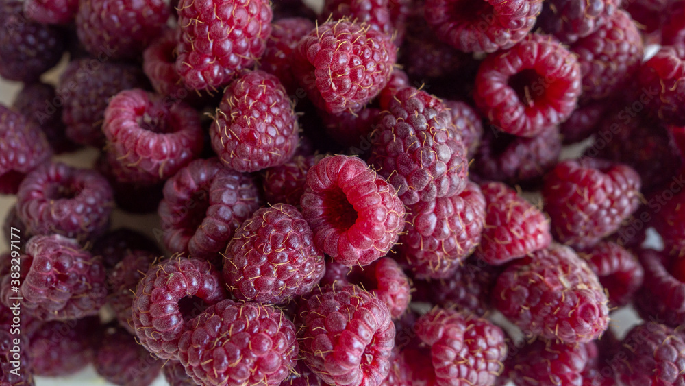 a bunch of ripe raspberries