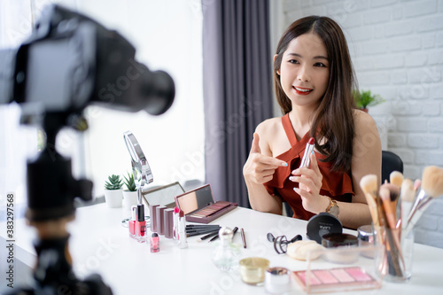 Beautiful young Asian blogger is showing you how to apply makeup with cosmetics. She shoots daily makeup tutorials.