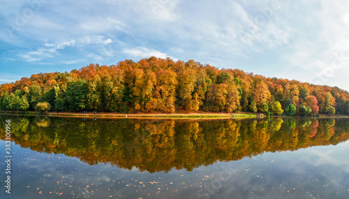 Panorama of the autumn Park. Beautiful autumn landscape with red trees by the lake. Tsaritsyno, Moscow