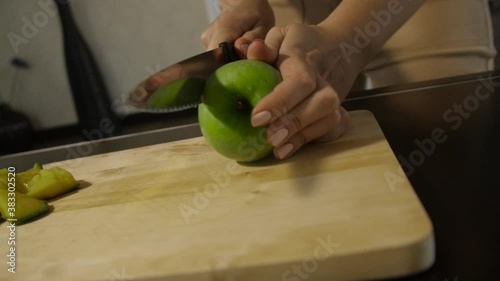 Rolling apple on the table